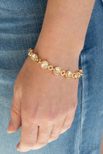 Load image into Gallery viewer, Paparazzi First In Fashion Show - Gold Bracelet
